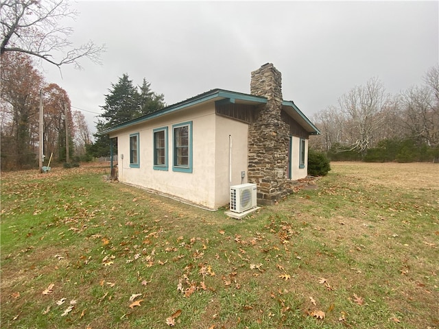 view of home's exterior with a lawn