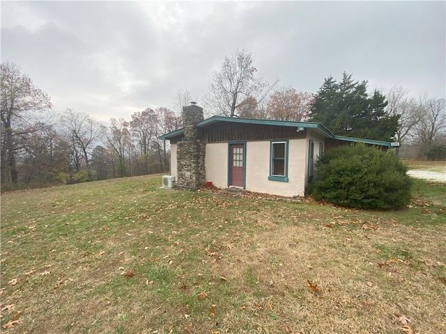 view of home's exterior featuring a lawn