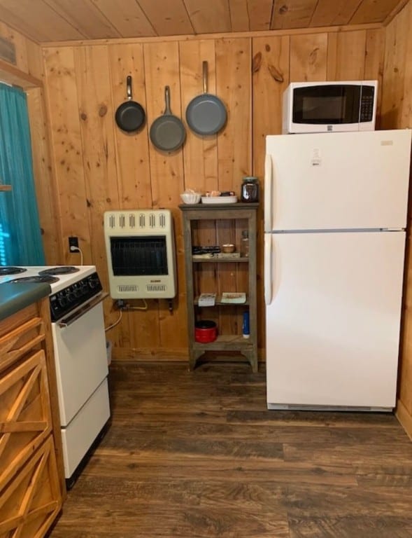 kitchen with heating unit, dark wood-type flooring, wood ceiling, and white appliances