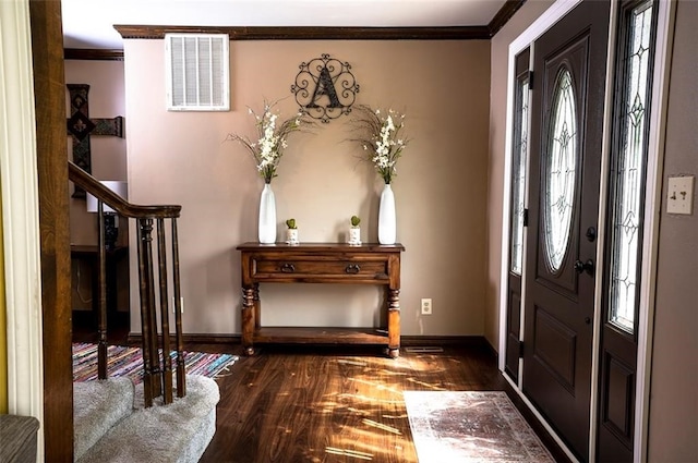 entrance foyer featuring ornamental molding and dark wood-type flooring