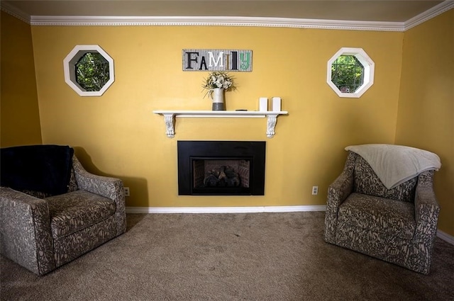 sitting room featuring carpet flooring and ornamental molding