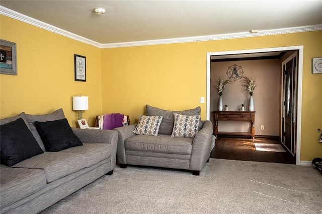 living room with hardwood / wood-style flooring and crown molding