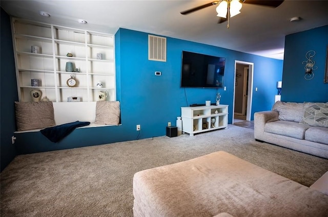 living room with carpet and ceiling fan