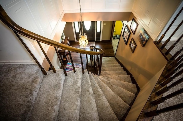 staircase with wood-type flooring