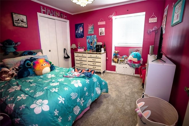 bedroom featuring carpet flooring, a closet, and ornamental molding