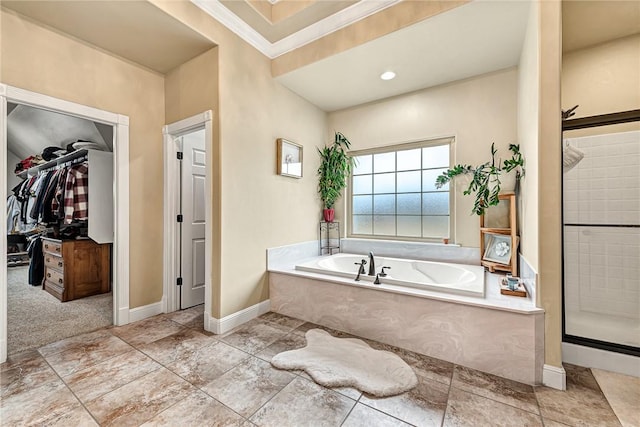 bathroom with crown molding and independent shower and bath