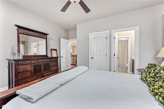 bedroom featuring ensuite bathroom and ceiling fan