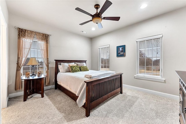 bedroom with light colored carpet and ceiling fan