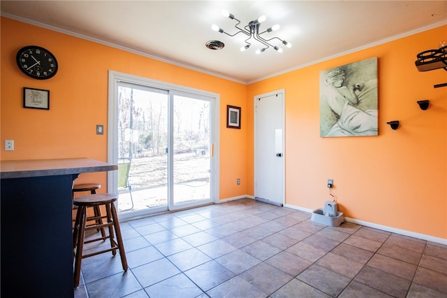 doorway to outside with crown molding, tile patterned flooring, and a wealth of natural light