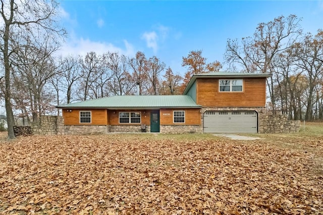15258 Shipe Rd, Gravette, AR 72736 - view of front facade featuring stone siding and a garage