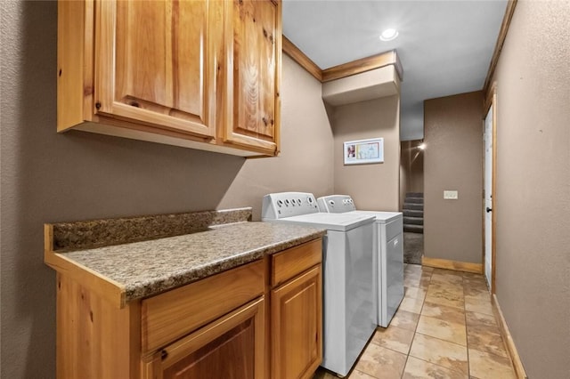 15258 Shipe Rd, Gravette, AR 72736 - washroom with separate washer and dryer, baseboards, cabinet space, and recessed lighting