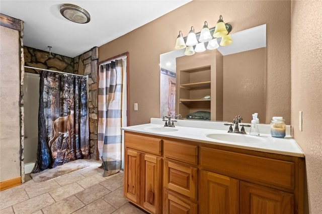 bathroom with tile patterned floors, a shower with curtain, and vanity