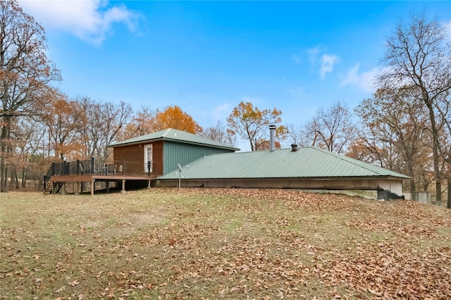 view of side of property with a wooden deck