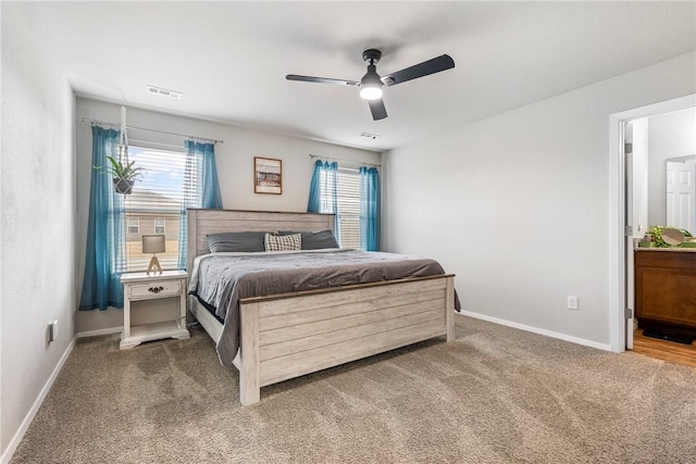 carpeted bedroom with ceiling fan