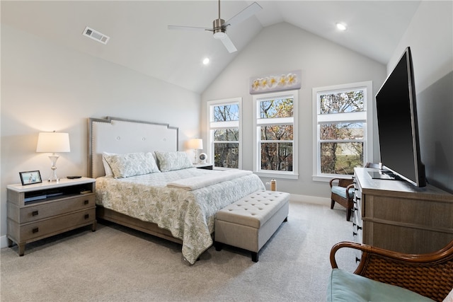 bedroom with ceiling fan, high vaulted ceiling, and light carpet