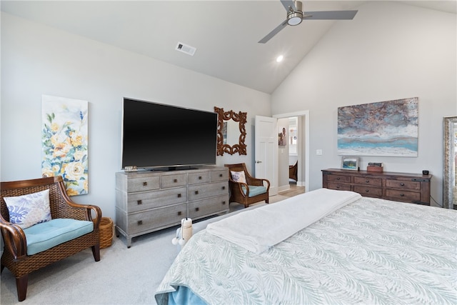 bedroom with ceiling fan, high vaulted ceiling, and light carpet