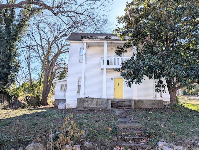 view of front of property with a balcony