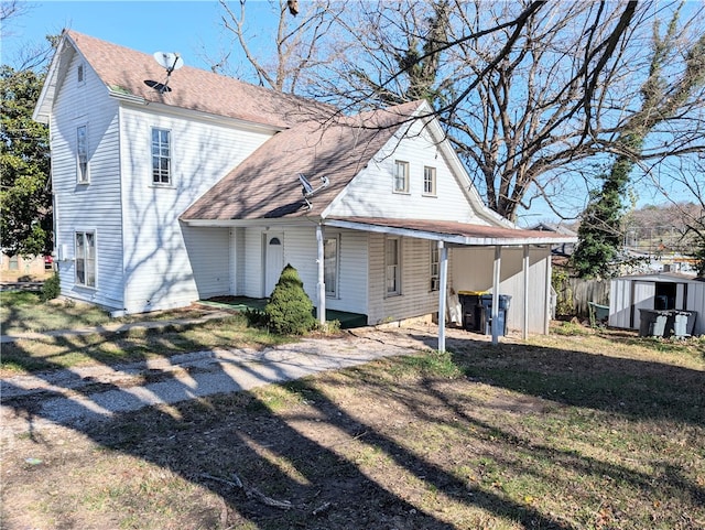 view of front of property with a shed