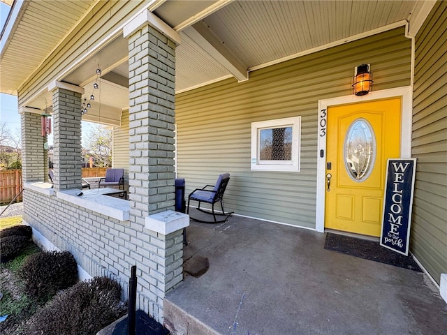 doorway to property with covered porch