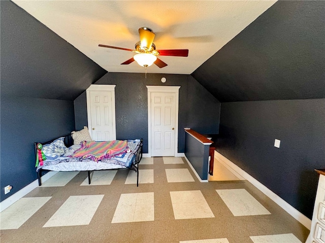 bedroom featuring ceiling fan and vaulted ceiling