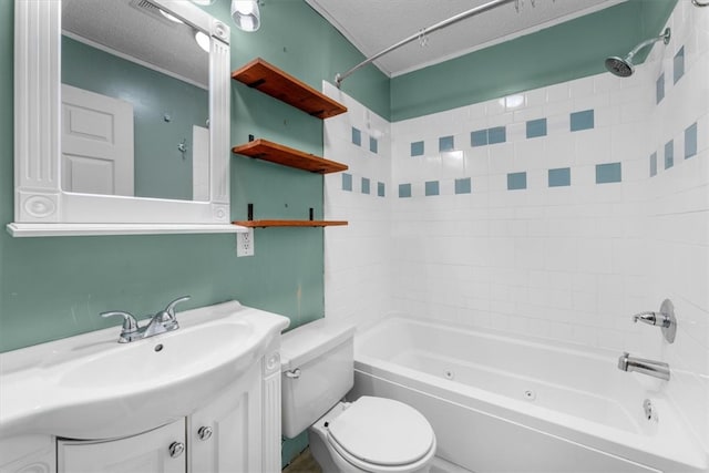 full bathroom featuring vanity, a textured ceiling, tiled shower / bath combo, and toilet