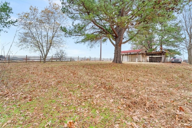 view of yard with a rural view