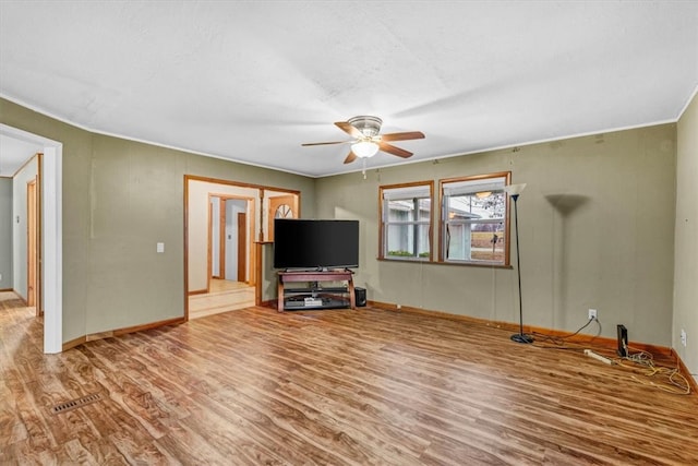 unfurnished living room with hardwood / wood-style floors and ceiling fan