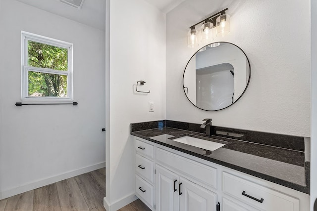 bathroom featuring hardwood / wood-style floors and vanity