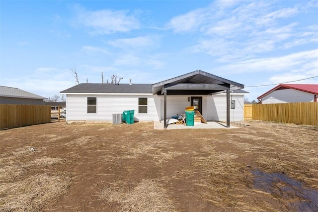 back of property with a patio