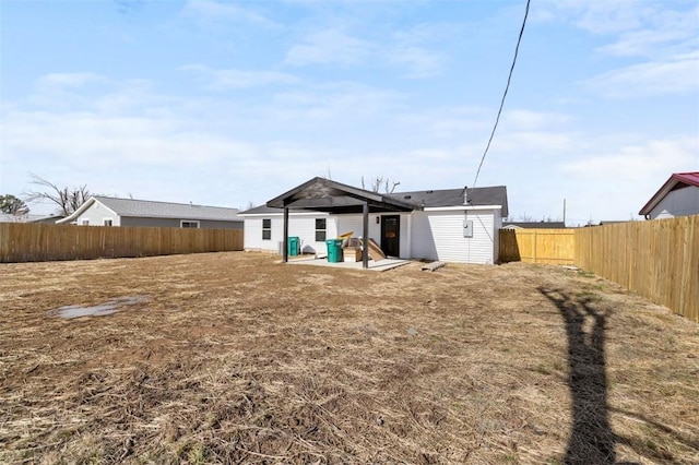 back of property with a patio area