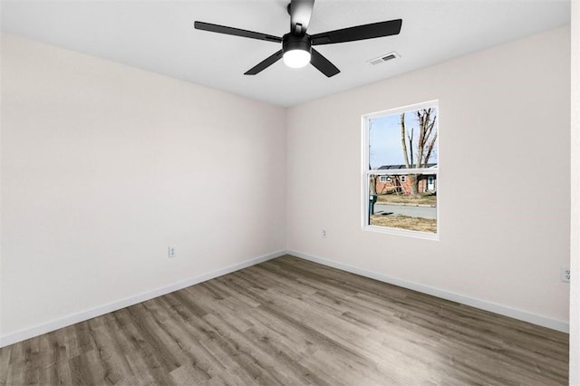 spare room featuring ceiling fan and light wood-type flooring