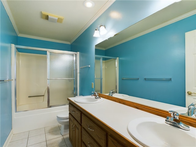 full bathroom featuring tile patterned floors, ornamental molding, bath / shower combo with glass door, vanity, and toilet