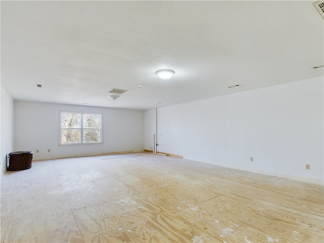 empty room with a textured ceiling