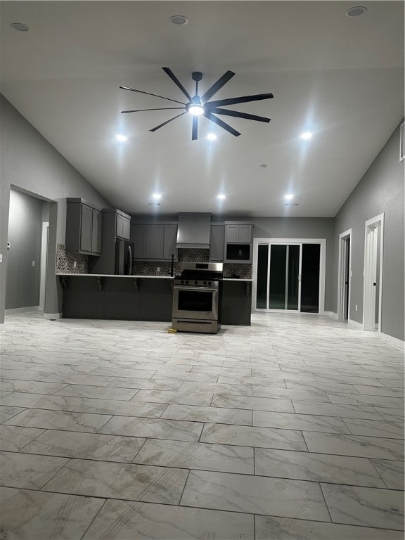 unfurnished living room with vaulted ceiling