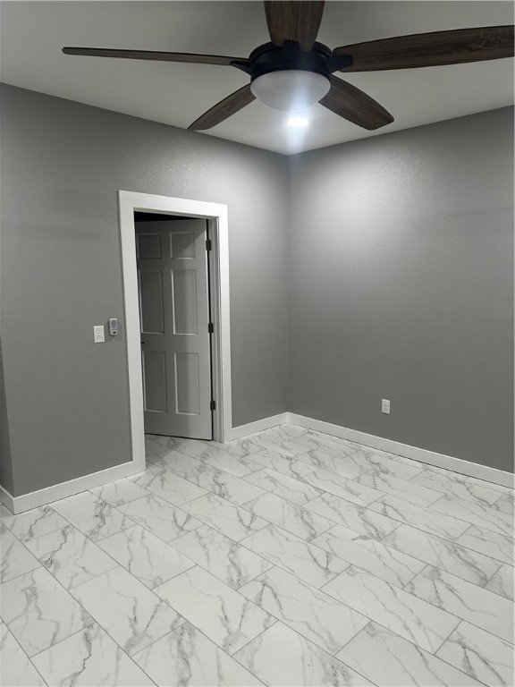 spare room with ceiling fan