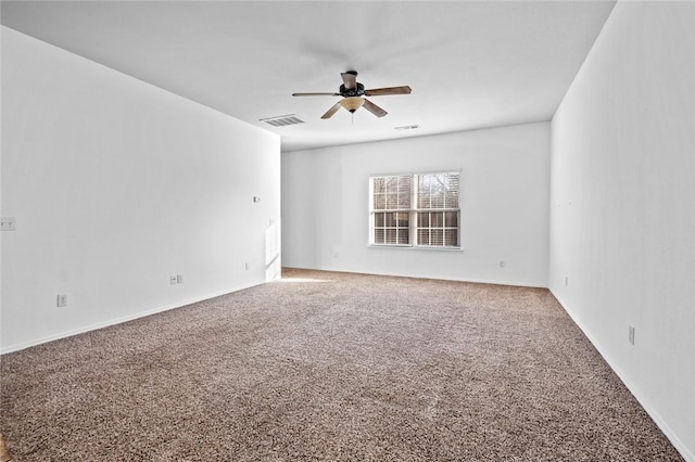 spare room featuring carpet flooring and ceiling fan