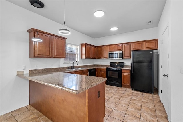 kitchen featuring black appliances, sink, decorative light fixtures, light tile patterned flooring, and kitchen peninsula