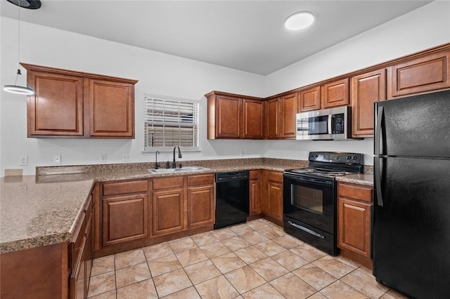 kitchen featuring black appliances, decorative light fixtures, light tile patterned floors, and sink