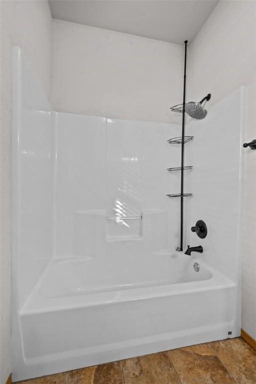 bathroom with shower / bathtub combination