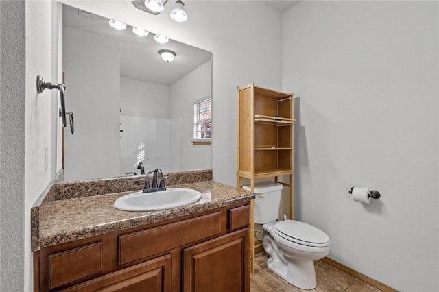 bathroom with tile patterned floors, a shower, vanity, and toilet