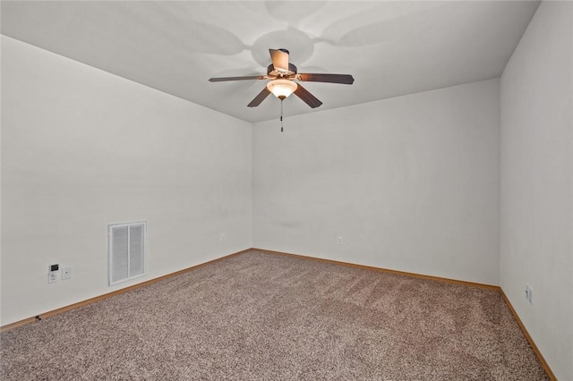 spare room featuring carpet and ceiling fan