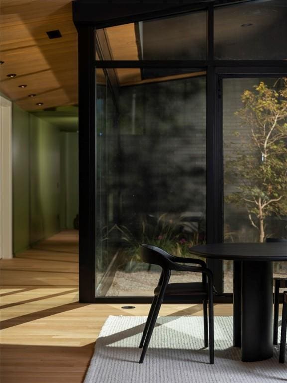 interior space featuring wood-type flooring and wooden ceiling