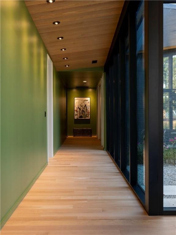 hall featuring wooden ceiling and light wood-type flooring