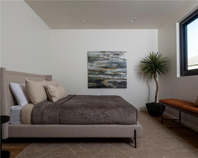 bedroom with hardwood / wood-style floors