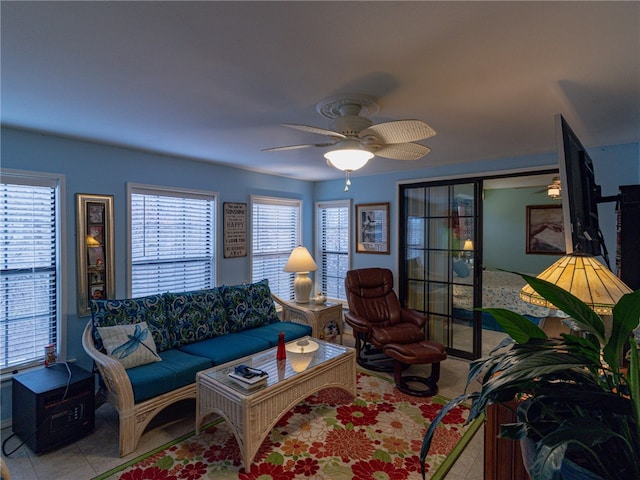 tiled living room featuring ceiling fan