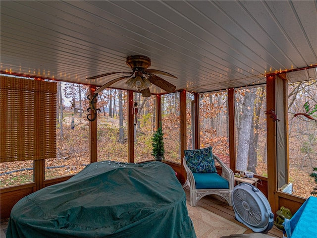 sunroom with plenty of natural light and ceiling fan