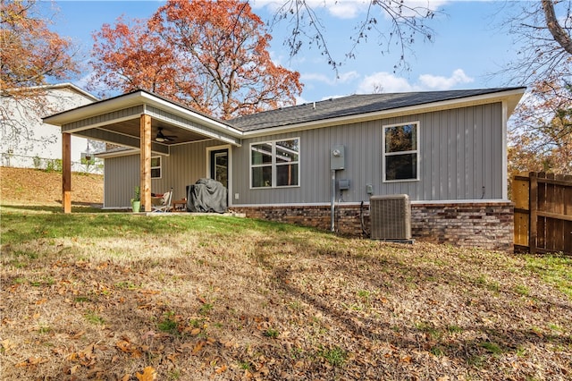 back of property featuring a yard, central AC unit, and ceiling fan