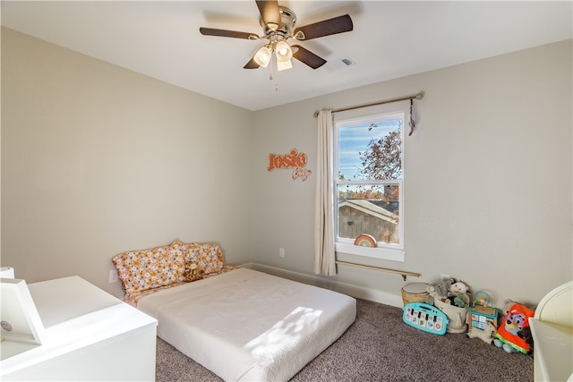 bedroom with ceiling fan and carpet