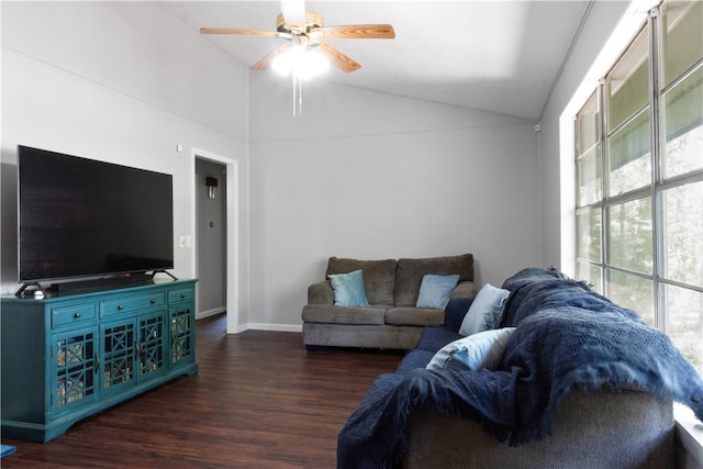 living room featuring plenty of natural light, ceiling fan, dark wood-type flooring, and vaulted ceiling