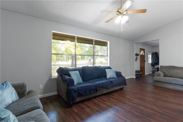 living room featuring a textured ceiling, lofted ceiling, ceiling fan, and dark hardwood / wood-style floors